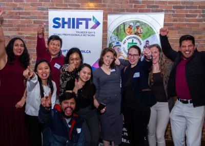 Excited your professionals pose in a group photo at a SHIFT event.